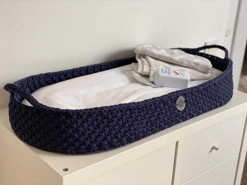 Blue baby changing basket with mattress